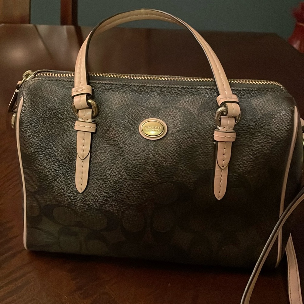 Coach bag with leather crossbody strap.